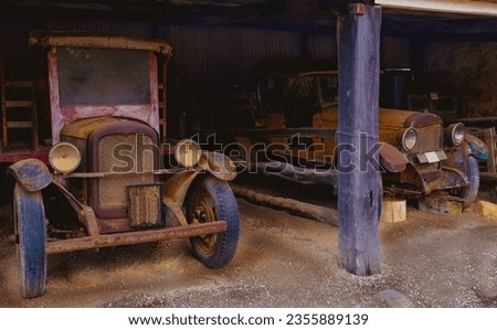 vintage cars in barn for restore