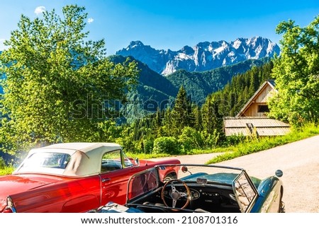 Vintage cars in front of slovenian Alps next to Logar valley, Slovenia. High quality photo