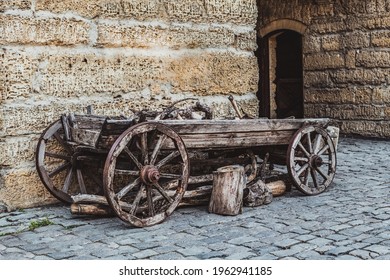 Vintage cart on wooden wheels near Odone Bazaar Capuses (the Gate of the Wood Bazaar) is part of the city-fortress of Gezlov. Gezlevsky Gate. - Shutterstock ID 1962941185