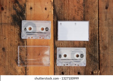 Vintage cassette tape on timber background awesome mix playlist demo 80s 90s love mixtape hip hop case