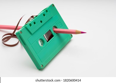 Vintage Cassette Tape With A Pencil For Rewind  On White Background