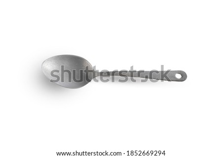 vintage cast aluminium ladle long handle isolated on white background.