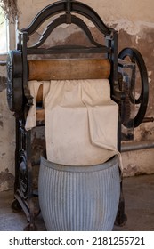Vintage cast iron mangle wringer machine and washing laundry dolly tub