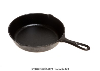 A vintage cast iron skillet or frying pan on white
