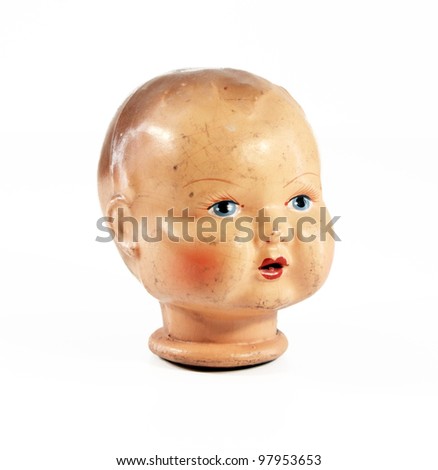 a vintage ceramic doll head, isolated on a white background
