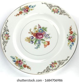 Vintage China plate with floral bouquet in the the middle and a floral rim with gold edge. - Powered by Shutterstock