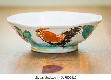 Vintage Chinese Chicken Bowl Signed On A Wood Background