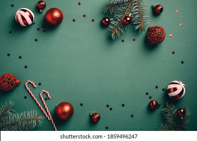 Vintage Christmas background with red and white balls decoration, fir tree branches, candy canes, confetti. Retro Christmas card template. - Shutterstock ID 1859496247