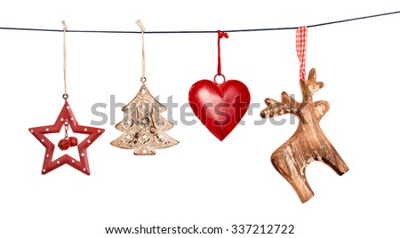 Vintage Christmas decorations hanging on string isolated on white background