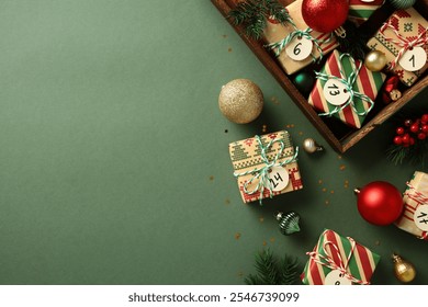 Vintage Christmas gifts with numbered advent calendar tags in wooden gift box, decorated with festive ornaments and fir branches. Flat lay, top view. - Powered by Shutterstock