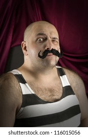 Vintage Circus Strongman With Big Mustache. Bald Strong Man With Striped T- Shirt. Part Of Larger Vintage Collection.