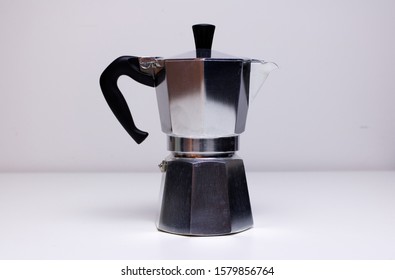 A Vintage Classic Aluminium Stovetop Espresso Coffee Maker On A Simple White Background