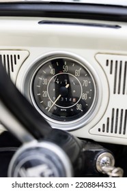 Vintage Classic White Retro Car Close Up Of Speedometer With High Milage Clocked With Key In Ignition.