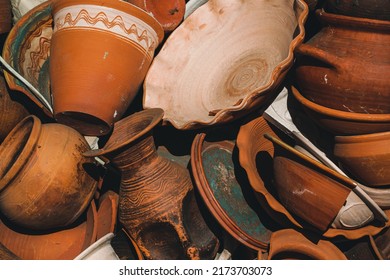 Vintage, vintage clay pots are piled on top of each other. Collection of baked clay tableware. Ancient clay jugs close-up. The concept of collecting vintage retro items. Pottery. - Powered by Shutterstock