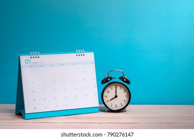 Vintage clock and calendar on wood, time concept