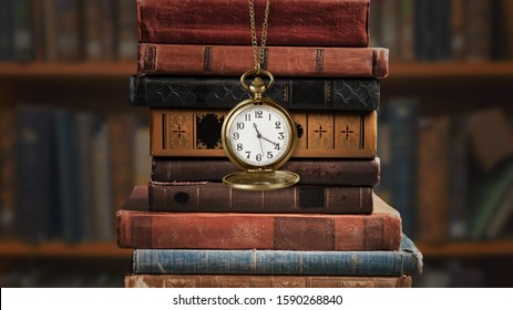 Vintage clock on a chain with old vintage books - Shutterstock ID 1590268840