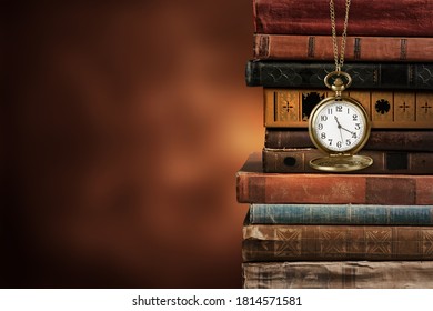 Vintage clock on a chain with old vintage books - Shutterstock ID 1814571581