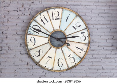 Vintage Clock On Gray Brick Wall