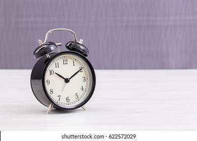 Vintage clock on table