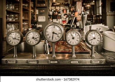 Vintage clocks on a bar counter in a pub