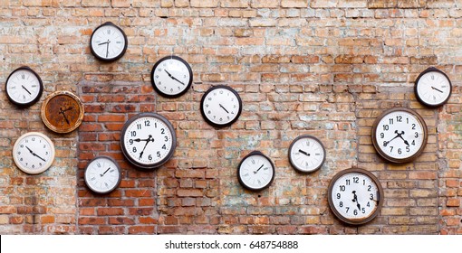 Vintage clocks on old brick wall. - Powered by Shutterstock
