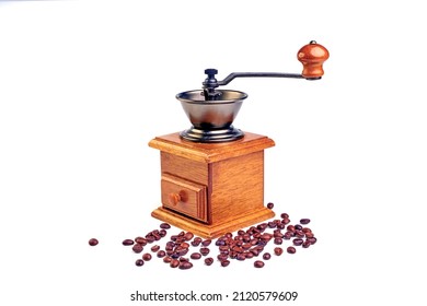 Vintage coffee grinder.Old retro hand-operated wooden and metal coffee grinder.Manual coffee grinder for grinding coffee beans. isolated on white background.