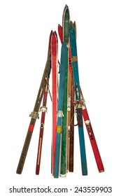 Vintage collection of different used skis isolated on a white background