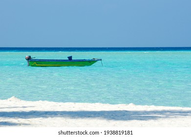Vintage Colorful Boat On Turquoise Water