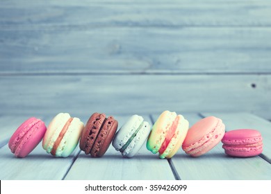 Vintage colorful macarons over turquoise wood
