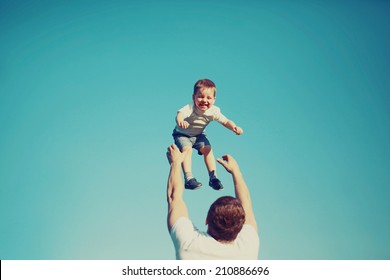 Vintage Colors Photo Happy Father And Child Having Fun Outdoors, Carefree, Blue Sky, Family, Travel, Vacation, Childhood, Father's Day - Concept