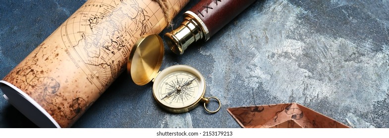 Vintage Compass, Spyglass, Paper Boat And World Map On Grunge Background. Travel Concept