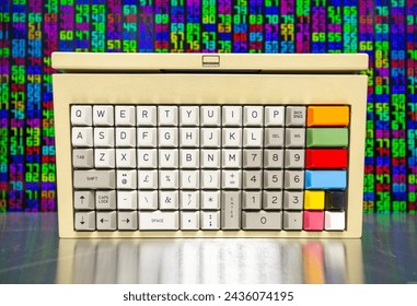 vintage computer keyboard with streaming data and code in background