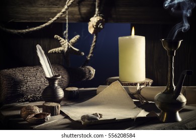 Vintage Concept Of Sea Travel, Writing A Letter On A Wooden Keg With A Burning Candle, Smoking A Hookah. Message In A Bottle On Old Paper. Cabin Wooden Vessel, Close-up, A Pirate Ship. Sea Adventure.