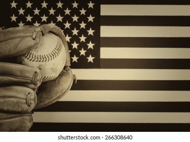 Vintage Concept Of Worn Leather Mitt And Used Baseball With United States Of America Flag In Background. 