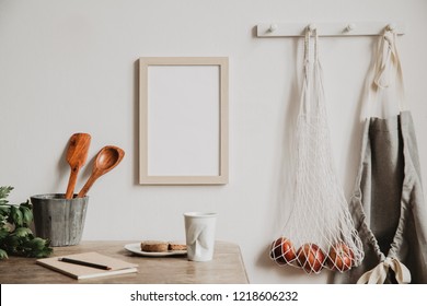 Vintage And Coozy Kitchen Interior With Mock Up Photo Frame, Notebook, Breakfast And Kitchen Accessories. Minimalistic Concept Of Kitchen Space.