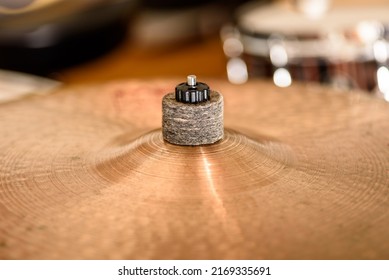 A vintage crash cymbal showing the felt washer that holds it in place.