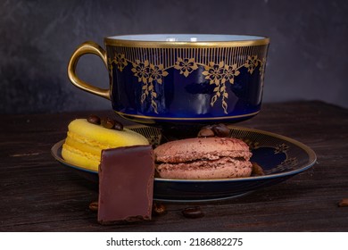 Vintage Crockery And Macaroon With Chocolate Pieces And Coffee Beans