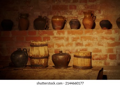 Vintage Crockery, Wooden Barrels In An Old Cellar.