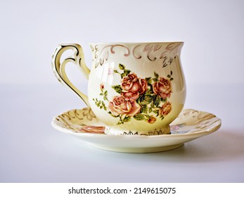  Vintage cup of tea with saucer isolated on white background ,Antique tea cup with rose pattern English style - Powered by Shutterstock