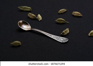 Vintage Cupronickel Spoon And Cardamom Seeds Close Up