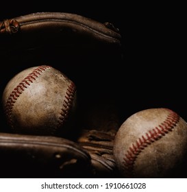 Vintage Dark Moody Sports Equipment With Baseball Glove And Balls From Recreation Sport Nostalgia.