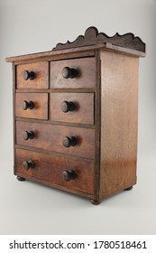 Vintage Dark Wood Miniature Chest Of Drawers Side On, Isolated On White, Image 2 In The Series Of 3 Images