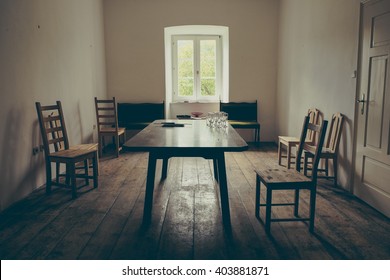 Vintage Dining Room With Wooden Floor And Chairs