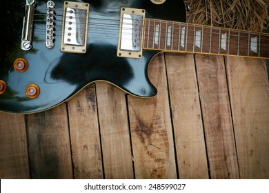 Vintage Electric Guitar On Wood