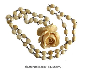 Vintage Elephant Ivory Necklace and Exquisite Carved Rose Pendant isolated on white background