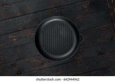 Vintage Empty Grill Pan On Dark Wooden Table Close Up, Top View