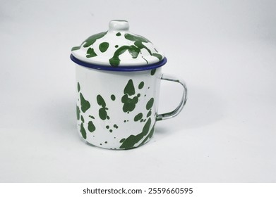 Vintage enamel mug with abstract Blirik green pattern isolated on white background with clipping path. Empty White Green tin mug mockup, traditional Indonesian style. Old-fashioned tin glass. - Powered by Shutterstock