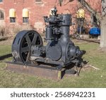 Vintage engine displayed outdoors at the 100 Center in Mishawaka, Indiana