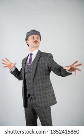 Vintage English Man With A Checkered Business Suit On A White Studio Solid Background