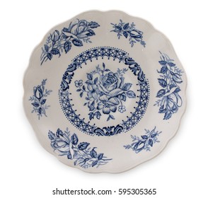 Vintage English porcelain. Very old saucer with blue floral decor, top view, close up. - Powered by Shutterstock